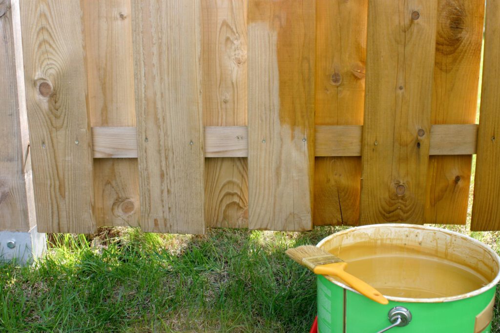 paint bucket beside the fence